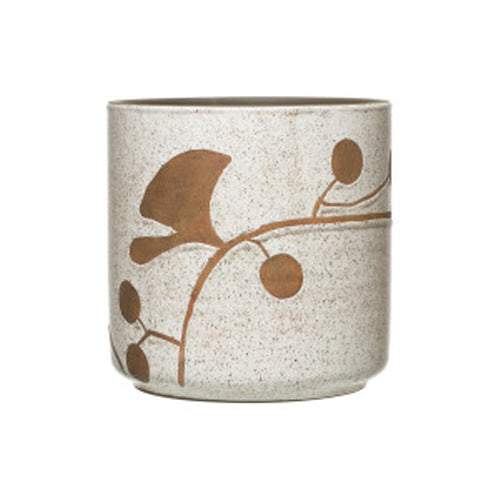 Cache-pot en terra-cotta avec fleurs, blanc tacheté